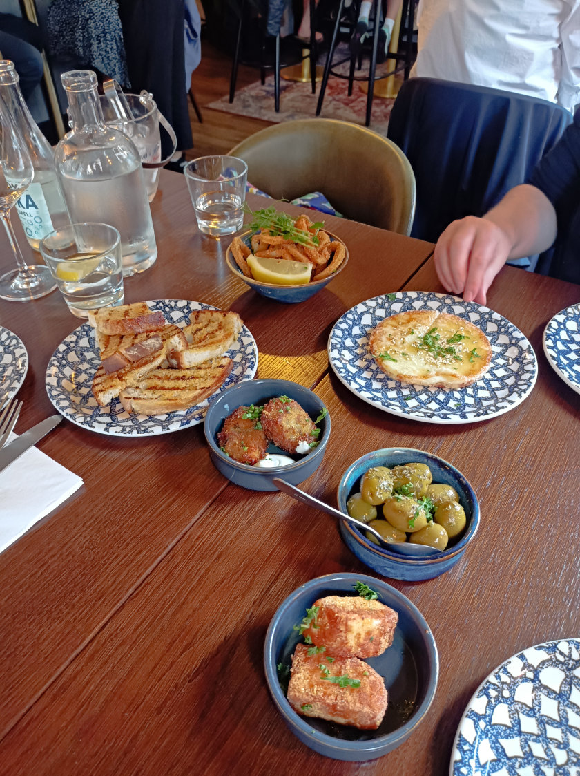 Squid rings, potatos and breads served at Panos Panos Tavern