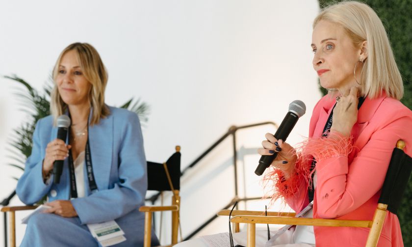 Two women in discussion panel