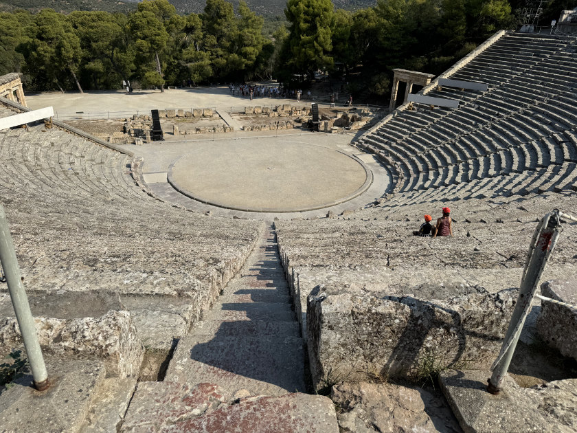 Epidaurus Amphitheatre, with only a few visitors seated.