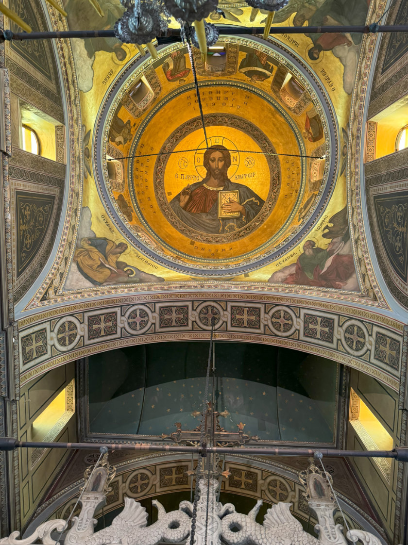 Elaborate ceiling in church with a figure of Jesus Christ.