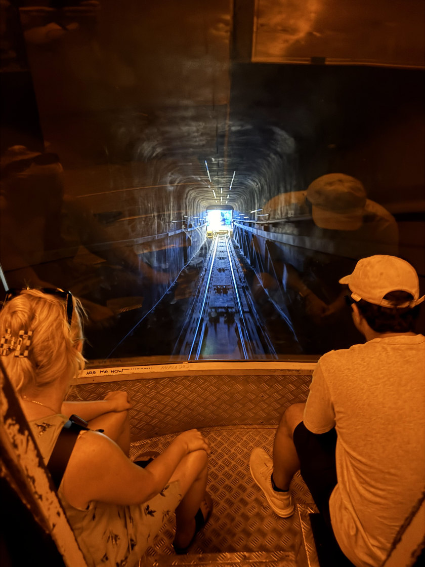 Descending on the Lycabettus Hill funicular, through a narrow tunnel.