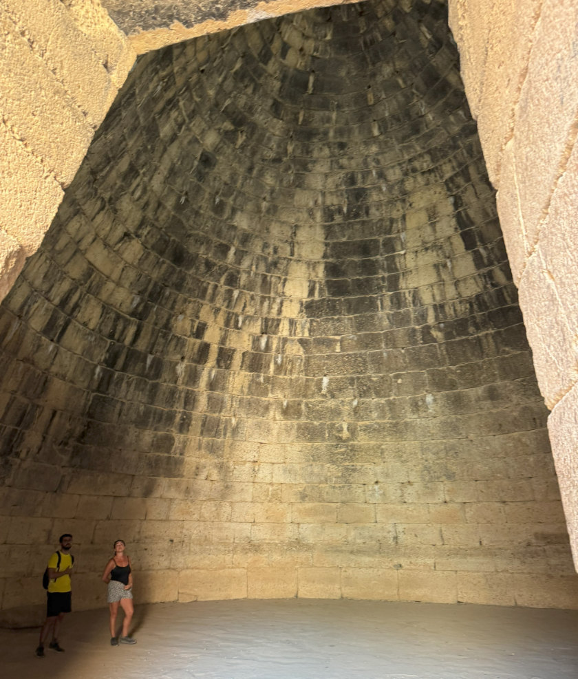 Tomb of Agamemnon, Mycenæ. Image shows a very tall walled structure.